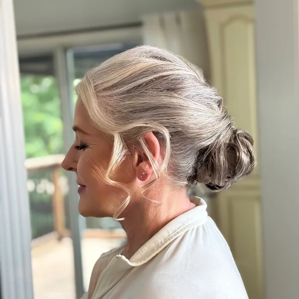 Soft Low Bun with Face-Framing Curls