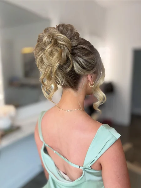 Curled High Bun with Tendrils