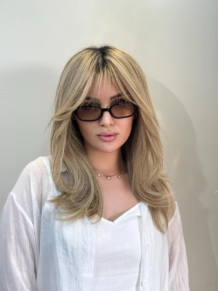 70s Shag with Bangs and Dark Roots