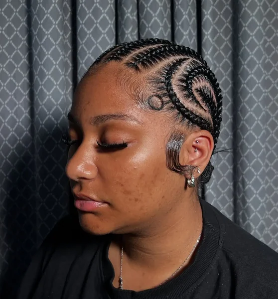 Swirl Stitch Cornrows Into Low Bun