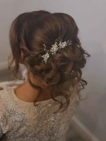 Curly Low Wedding Updo with Pearl Pins