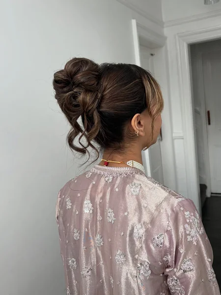 Messy High Bun with Curtain Fringe