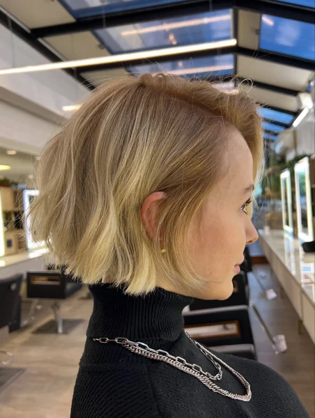 Tucked Textured Blonde Bob