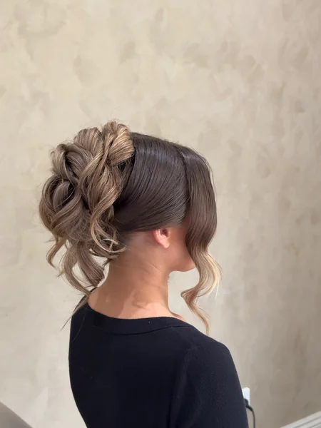 Sleek-Top Curly High Bun