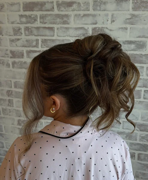 Messy Bridesmaid Updo with Loose Curls