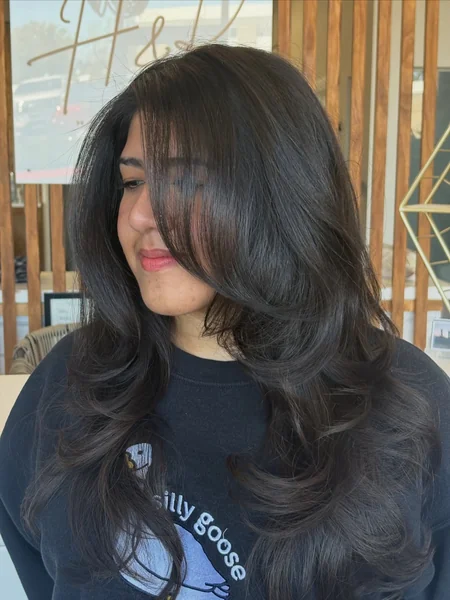 Butterfly Haircut with Side-Swept Bangs