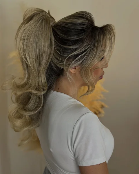 Bombshell Ponytail with Curtain Bangs