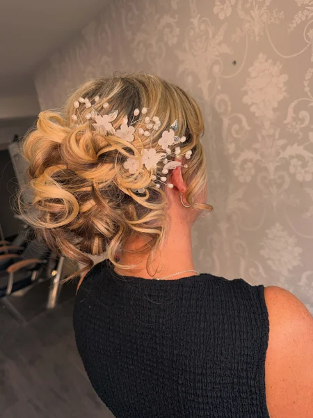 Curly Wedding Updo with Floral Hair Vine