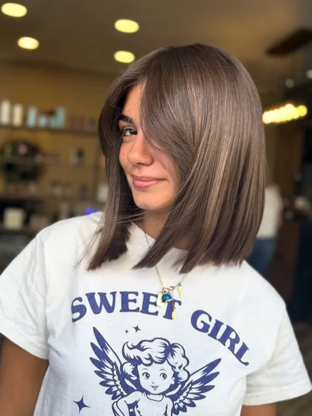 Glossy Brunette Lob with Long Fringe