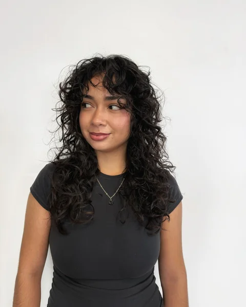 Long Black Curls with Wispy Bangs