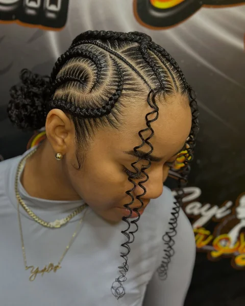 Swirl Cornrows into Curly Bun