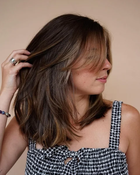 Medium Layers with Curtain Bangs