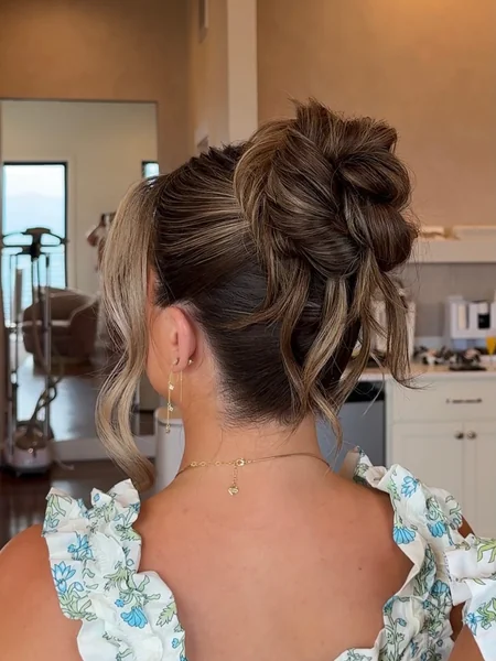 Cute High Twisted Bun for Wedding Guests