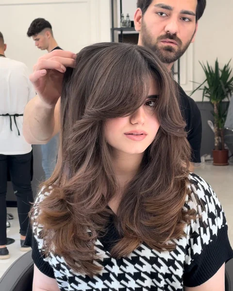 Brunette Butterfly Cut with Side Bangs