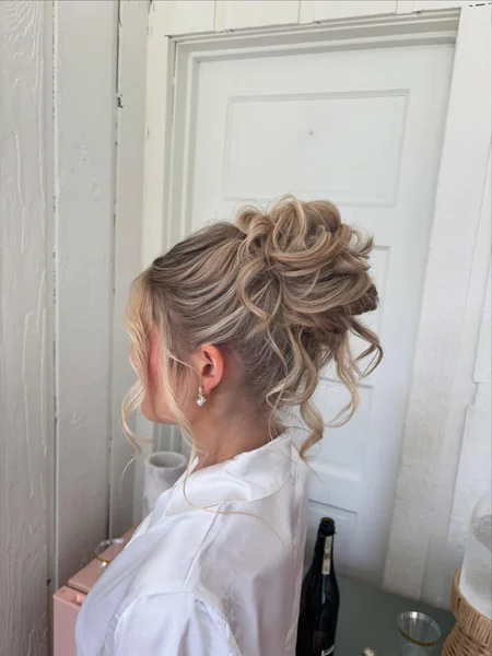 Messy High Bun with Curls