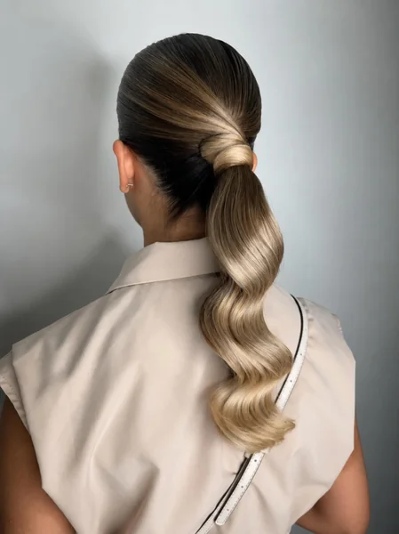 Sleek Low Ponytail with Waves
