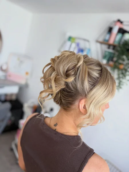 High Messy Bun Updo with Side Bangs