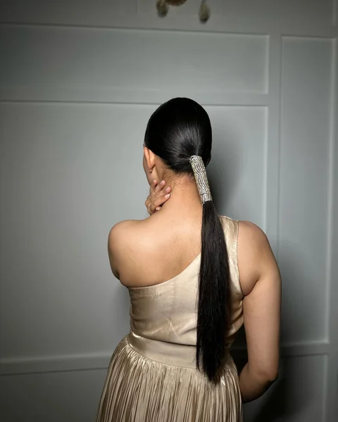 Low Sleek Ponytail with Crystal Cuff