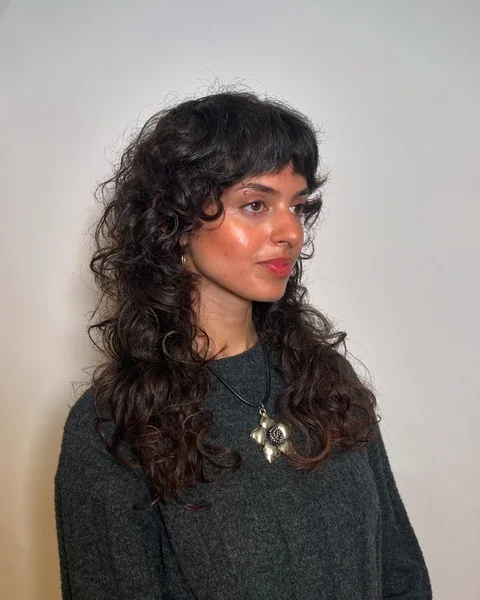 Curly Shag Haircut with Wispy Bangs