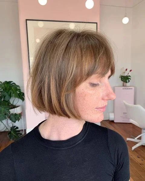 Effortless Layered Bob with Soft Brow Grazing Fringe