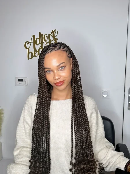 Fulani Braids with Brown Curly Ends and Simple Parting Design