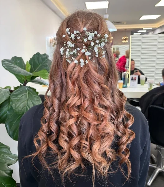 Half Up with Babys Breath on Auburn Curls
