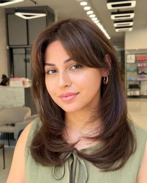 Layered Brown Hair with Side Swept Bangs