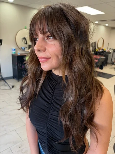 Long Dark Wavy Hair with Curtain Bangs