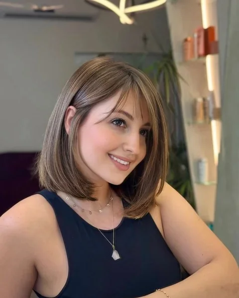 Mid Length Caramel Bob with Soft Curtain Bangs