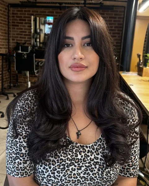 Sleek Curtain Bangs on Long Dark Hair
