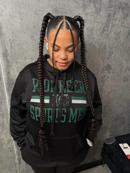Two Braids Styled into High Pigtail Loops