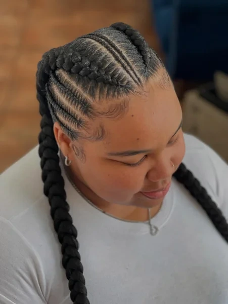 Two Braids with a Sharp Side Part Detail