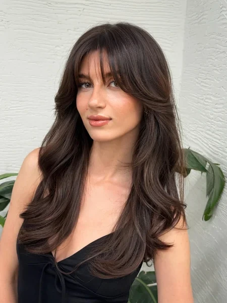Wavy Dark Hair with Side Swept Bangs